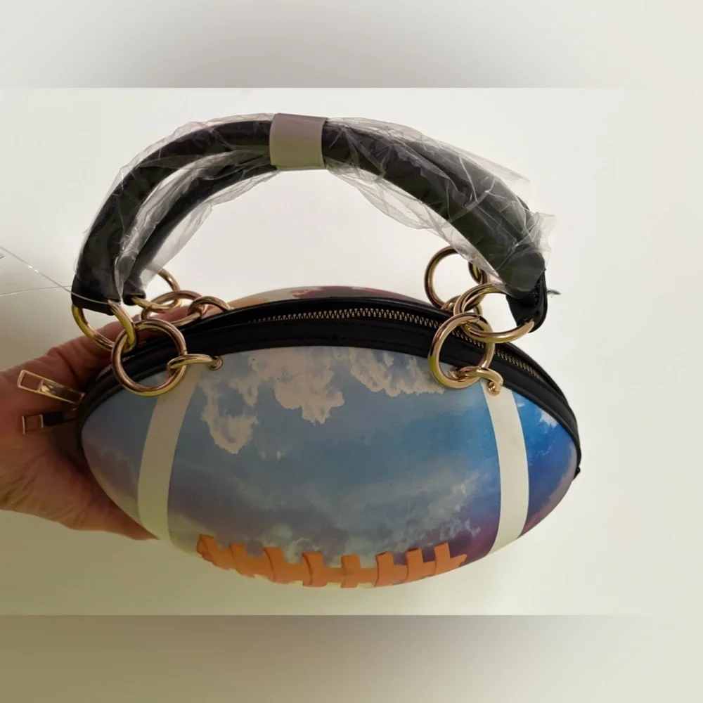 NWT-whimsical tie-dyed clouds  Pristine pebbled Rugby football purse gold chain